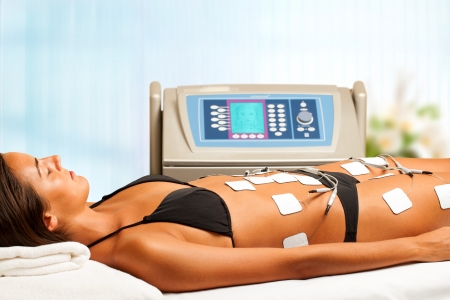 Young woman having electrical lymphatic drainage in spa.の写真素材
