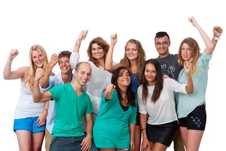 Group Portrait of young people raising hands together.Isolated on white background.の写真素材