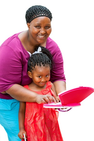 Close up portrait of african tutor helping girl with homework on laptop.Isolated on white background.の写真素材