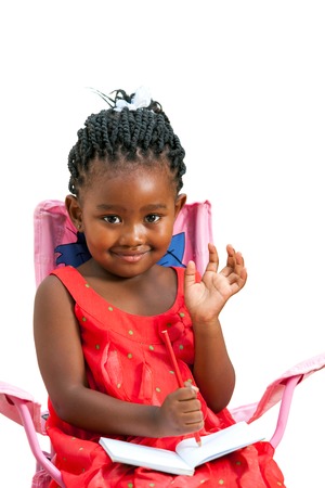 Portrait of sweet african girl with note book waving hand.Isolated on white background.の写真素材