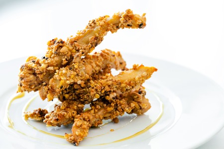 Close up of deep fried marinated chicken with dried fruits.の写真素材