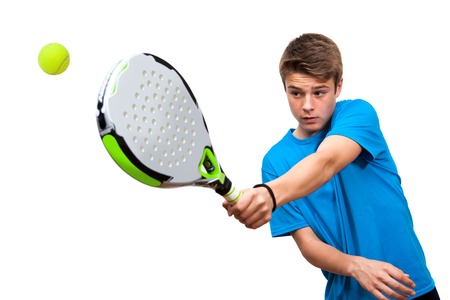 Close up of teen boy paddle player in action isolated against white background.の写真素材