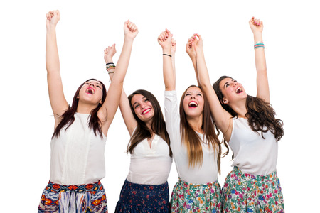 Portrait of Happy Teen Girls raising arms.Isolated on white background.の写真素材