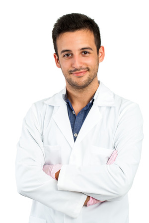 Close up portrait of young male doctor isolated on white background.の写真素材