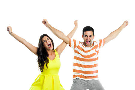Close up portrait of couple shouting with arms raised.isolated on white background.の写真素材