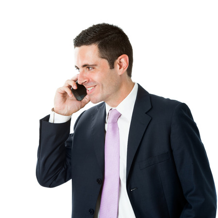 Portrait of Young businessman in suit talking on smart phone.Isolated on white background.の写真素材