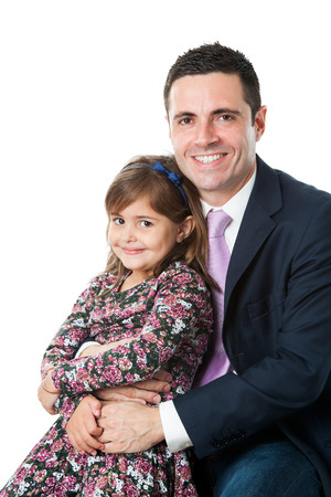 Close up portrait of young attractive businessman in suit with his little daughter on lap.Isolated on white background.の写真素材