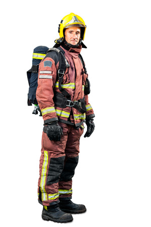 Full length portrait of Fireman in uniform isolated on white background.の写真素材