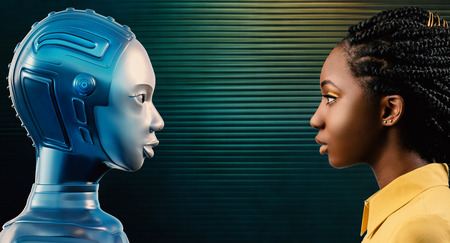 Side view portrait of attractive young black woman looking at her robot avatar. Two females looking at each other against green background.の写真素材