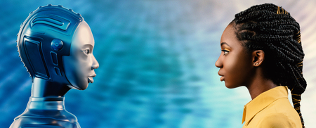 Side view portrait of attractive young African woman looking at robot avatar. Two females looking at each other against blue background.の写真素材