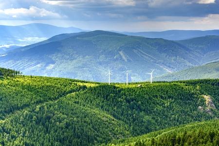 View of three wind power plants in the mountains. Ecological electricity in the Czech Republic.
