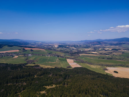 Aerial view of Orlicke hory with meadows, forests during beautiful day. Czechia.の写真素材