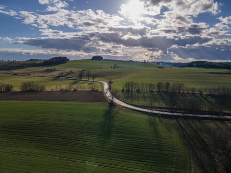 Beautiful spring view of green meadows and blue sky with clouds. Czechiaの写真素材