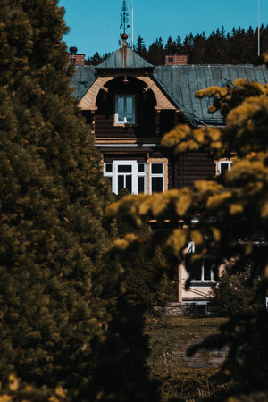 Karlova Studanka, Czech republic - 27.5.2023: Detail of the spa building behind the bushのeditorial素材