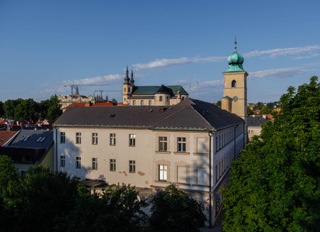 View of castle, church, monastery and city hall tower during sunset. Litomysl, Czech Republic.の写真素材