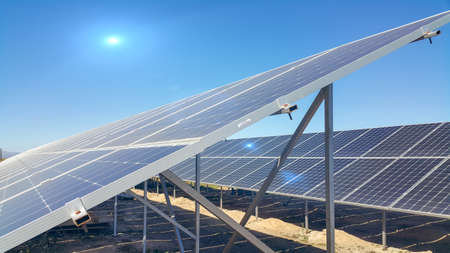 solar panels installed on the ground, sunlight falls on it, environmentally friendly renewable energy, cheap and modern way to generate electricityの写真素材