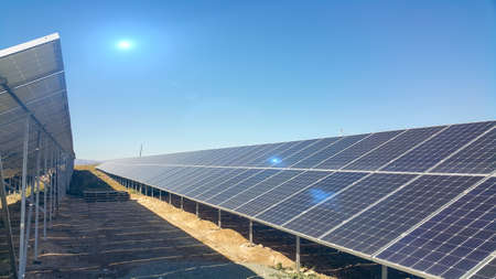 solar panels installed on the ground, sunlight falls on it, environmentally friendly renewable energy, cheap and modern way to generate electricityの写真素材