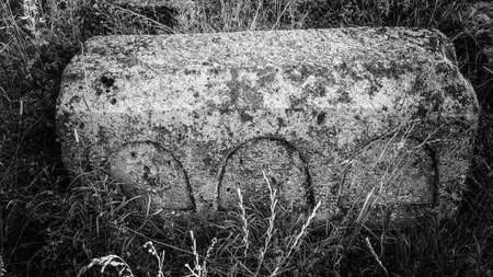 Ancient Armenian cemetery. Christian Grave of 1800 Burial place. Carved tombstone. Very old threaded stones. Memorial to the memory of the old world. Historical memory.の写真素材