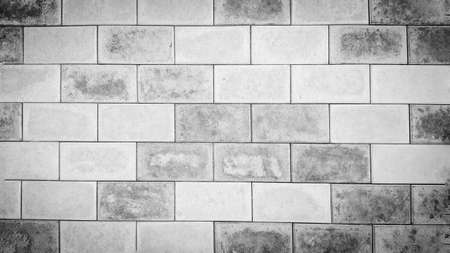 Background of the brickwork. Structural material. For designers. Interior of the building facade. Masonry. Construction industry. The color is gray.の写真素材