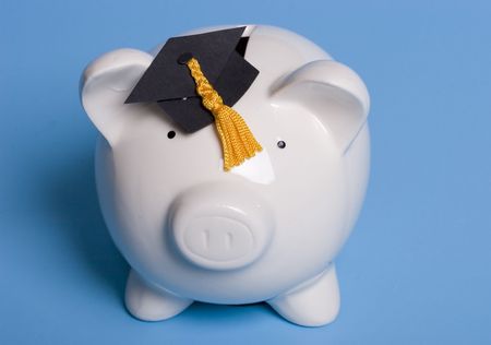 Piggy bank with a graduation capの写真素材