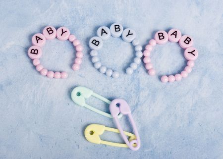  bracelets and diaper pins on a blue backgroundの写真素材