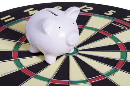 Dart board with piggy bank on targetの写真素材