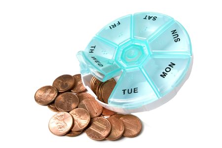 Pill container spilling out money of pennies