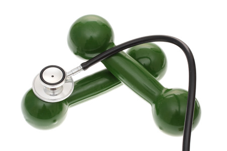stethoscope with a set of dumbbells exercise and health issuesの写真素材