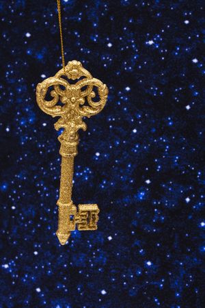 Gold key ornament of night sky backgroundの写真素材