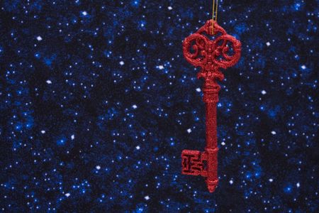 Red key ornament on star background with copy spaceの写真素材