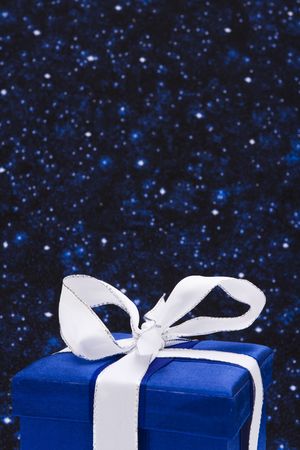 Blue present on a night sky backgroundの写真素材