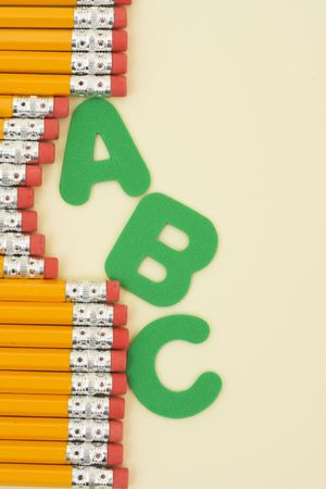 Row of pencils and letters の写真素材