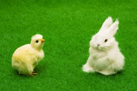 Bunny and chick on grass with copy spacesの写真素材