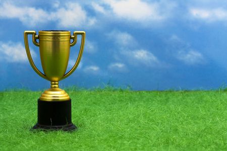 Trophy sitting on grass with copy spaceの写真素材