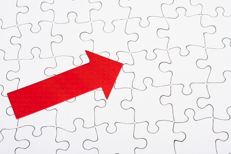 Completed puzzle with arrowの写真素材