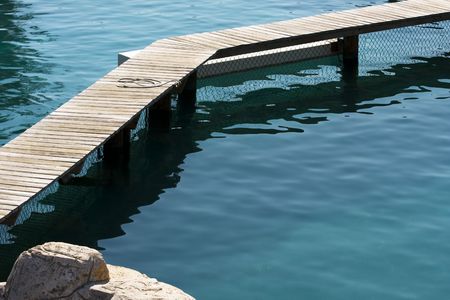 Boardwalk going out over water with copy spaceの写真素材