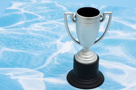 Trophy on blue and white swirl backgroundの写真素材