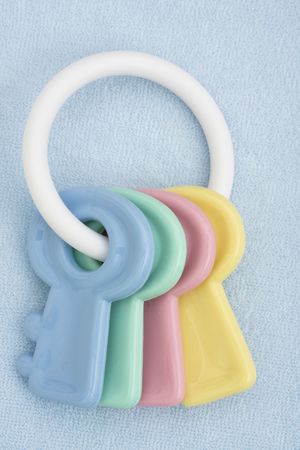 A blue  facecloth with toy keysの写真素材