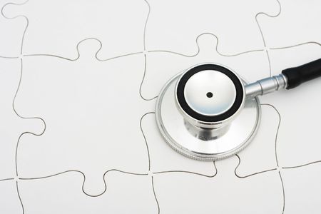 Stethoscope on puzzle, solving the mystery of health careの写真素材