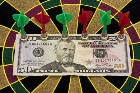 Magnetic dart board with darts  on target with your moneyの写真素材