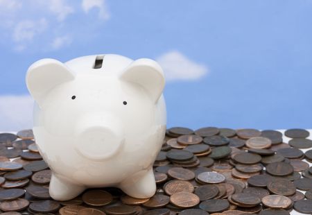 Piggy bank on a pile of coins