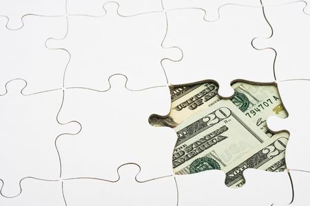 Puzzle with money, understanding money and investingの写真素材
