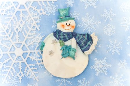 Blue background with close up of snowflake making a border with snowman, snowflake borderの写真素材