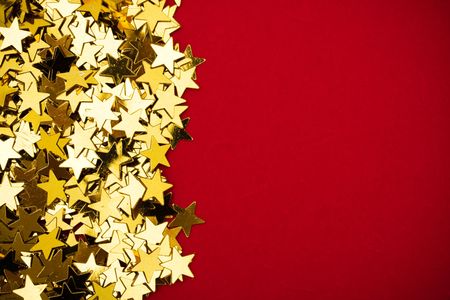 Gold stars making a border on red background, gold star borderの写真素材