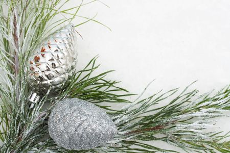 Christmas tree limb with silver glass ornaments on white , Christmas borderの写真素材