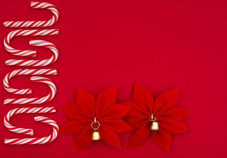 Candy cane and poinsettia border on red background, Christmas borderの写真素材