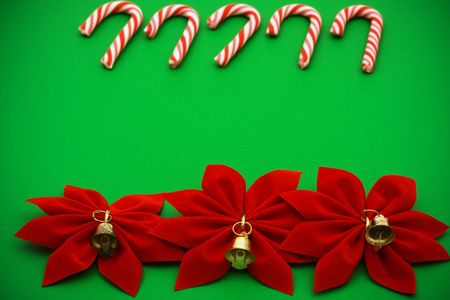 Candy cane and poinsettia border on green background, Christmas borderの写真素材