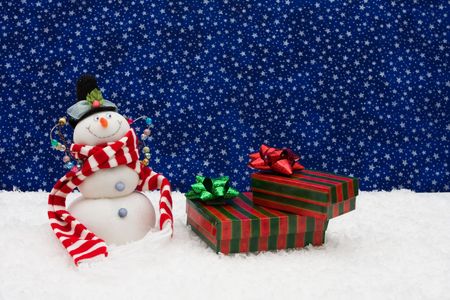 Snowman and striped presents on star background, snowman and presentsの写真素材