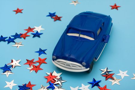 An older car and colourful stars on a blue background, American bailout car moneyの写真素材