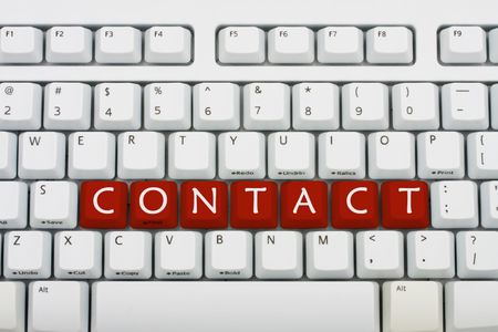 A grey keyboard with the word contact, contacting usの写真素材